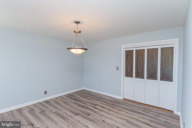 unfurnished room with light wood-type flooring