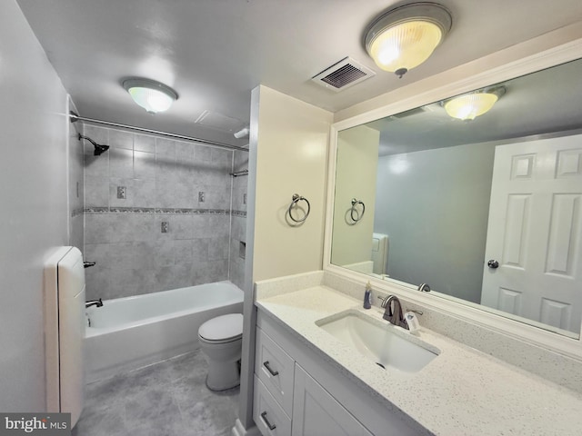 full bathroom with radiator, vanity, tiled shower / bath combo, and toilet