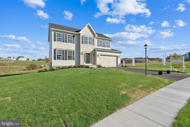 view of front of property with a front lawn and a garage