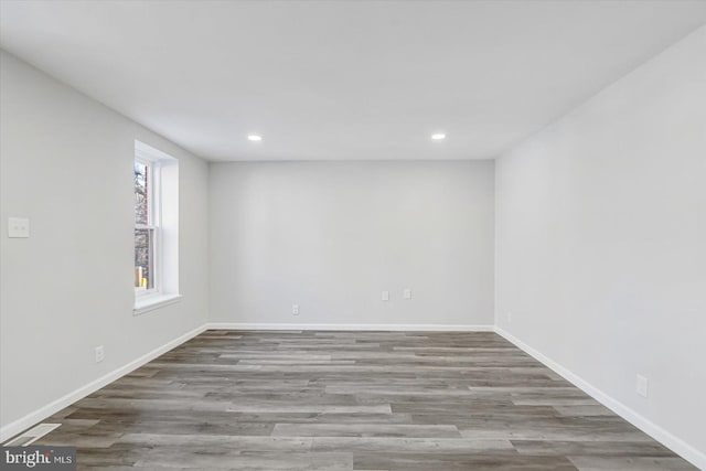 spare room with hardwood / wood-style floors