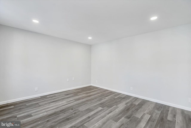 spare room featuring hardwood / wood-style flooring