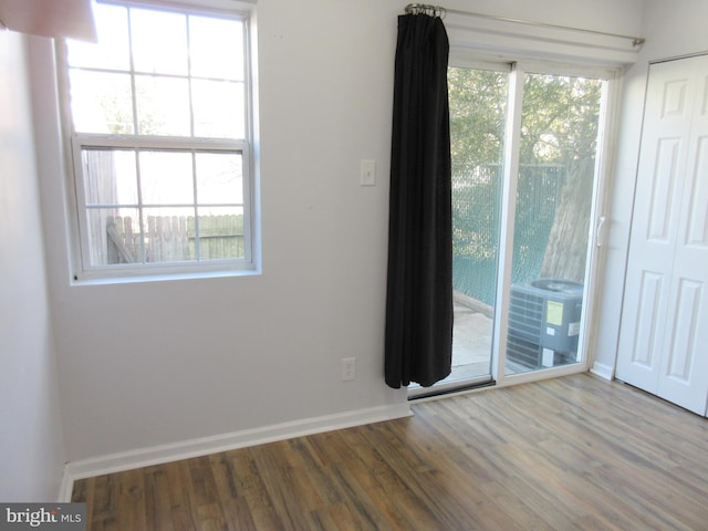 empty room featuring wood-type flooring