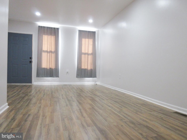 empty room featuring dark hardwood / wood-style floors