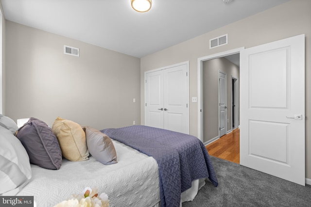 carpeted bedroom with a closet