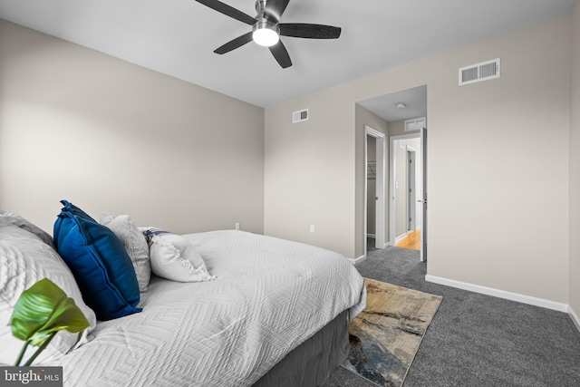 bedroom with carpet flooring, connected bathroom, and ceiling fan