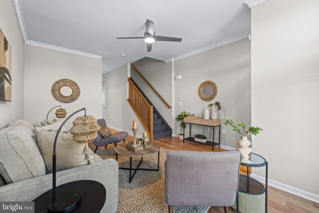 1020 N Eden St, Baltimore, MD 21205 - living room featuring wood finished floors, ceiling fan, stairway, baseboards, and ornamental molding