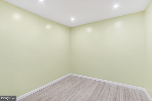 unfurnished room with light wood-type flooring