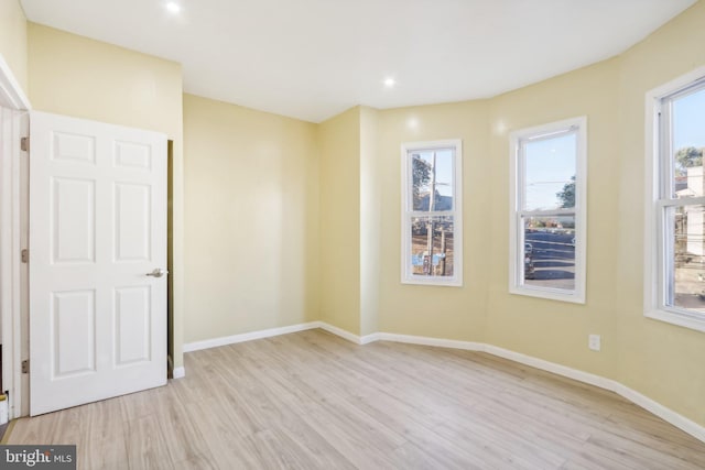 spare room with light wood-type flooring