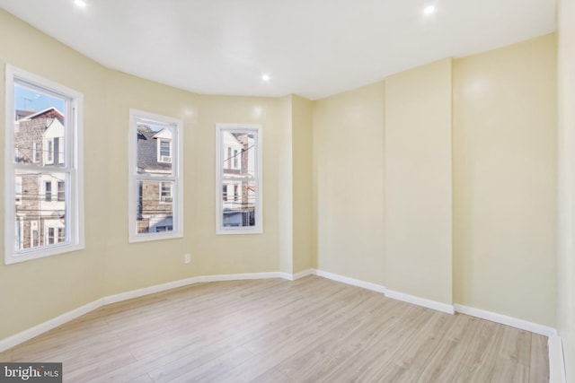 empty room with light wood-type flooring