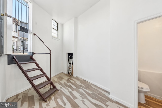 stairway featuring hardwood / wood-style floors