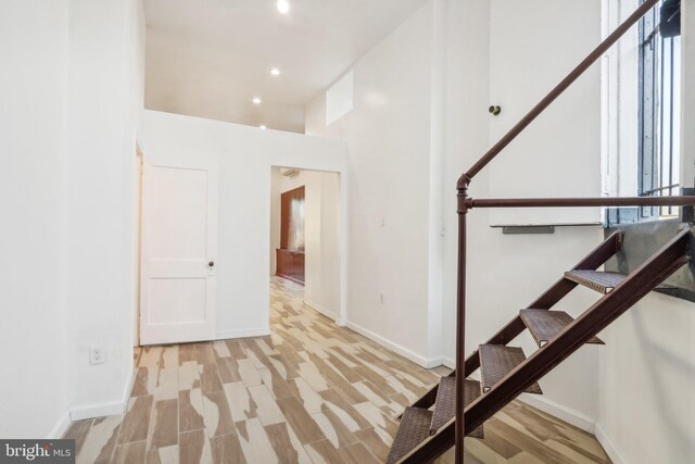 staircase featuring hardwood / wood-style floors