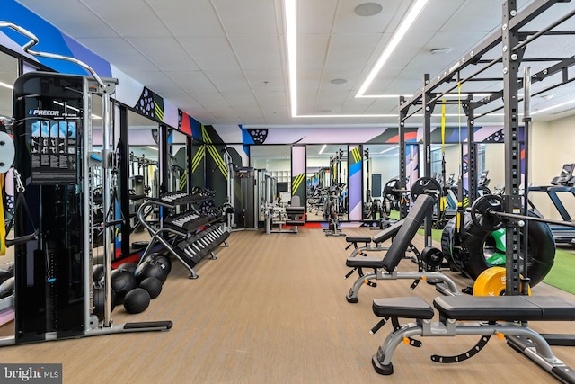 exercise room featuring a drop ceiling