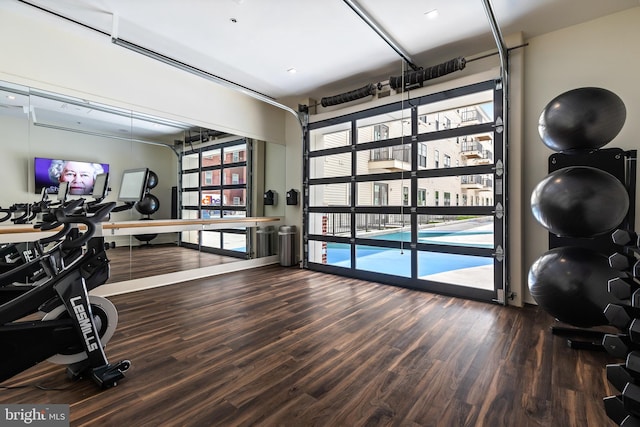 exercise area with hardwood / wood-style flooring