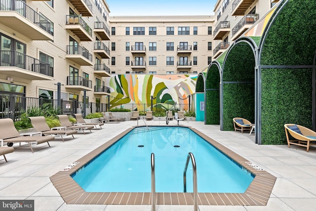 view of swimming pool with a patio area