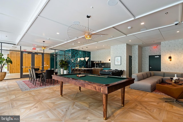 playroom featuring light parquet floors and billiards