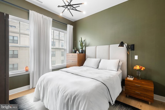 bedroom featuring wood-type flooring