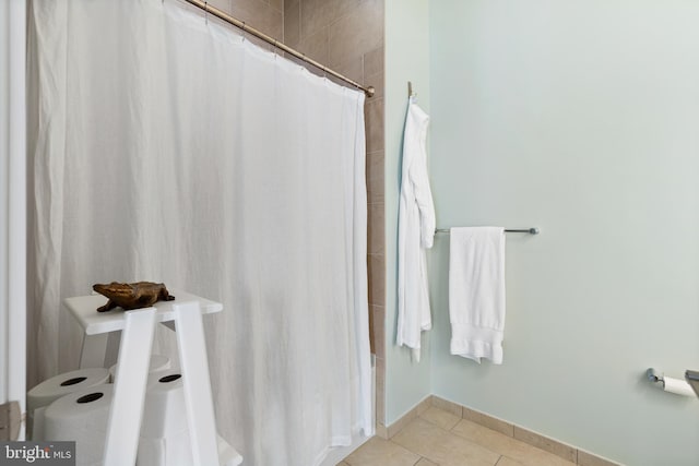 bathroom featuring tile patterned floors and a shower with shower curtain