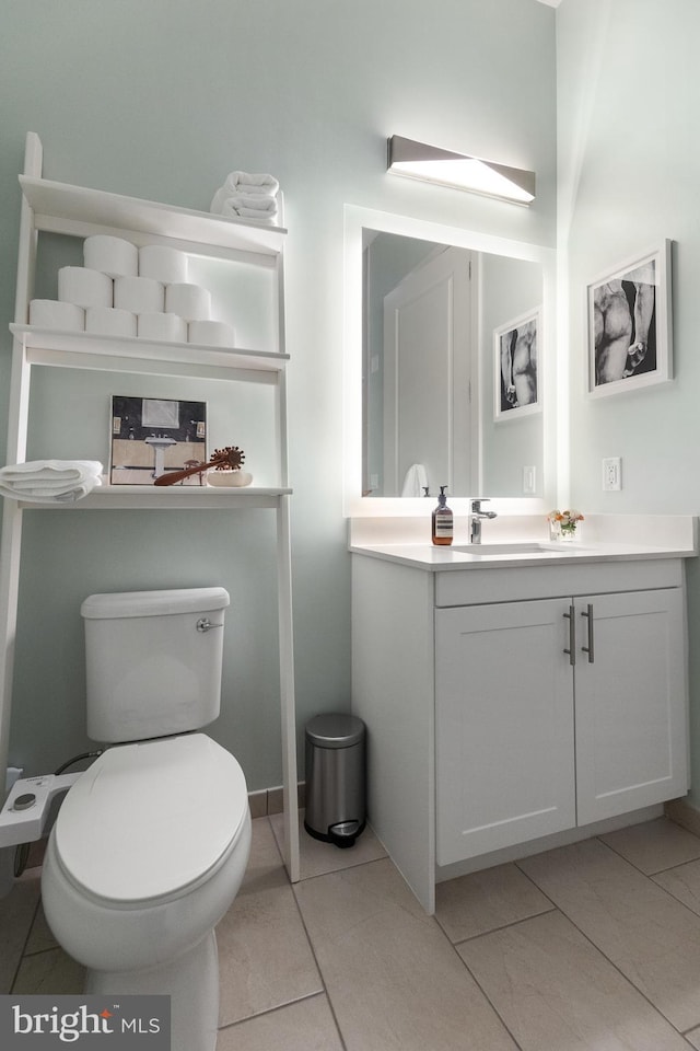 bathroom featuring vanity, toilet, and tile patterned floors