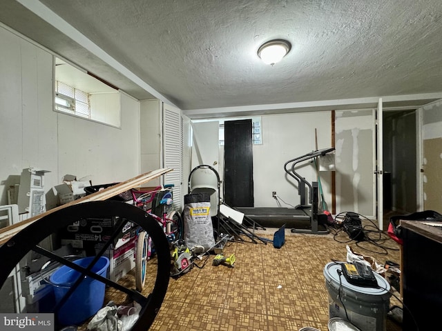 workout area with a textured ceiling