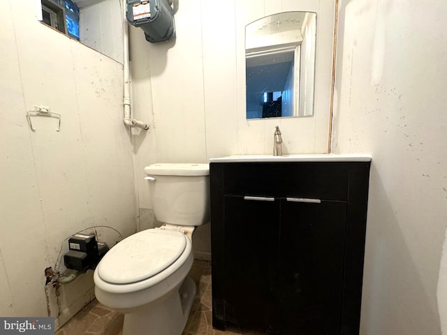 bathroom with toilet and vanity