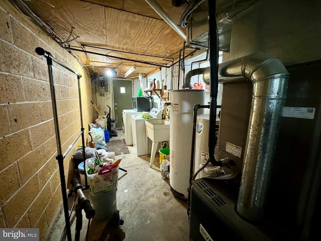 utility room with water heater, heating unit, and separate washer and dryer