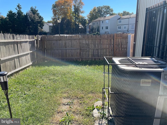 view of yard featuring central AC