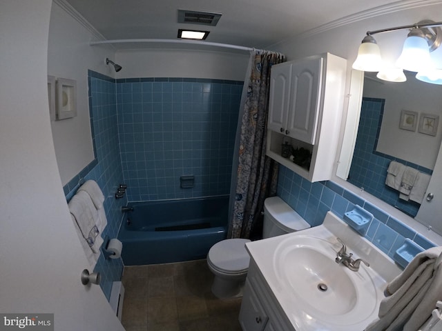 full bathroom featuring shower / bath combo, toilet, vanity, ornamental molding, and tile patterned flooring