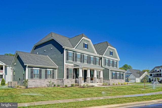 view of front of home featuring a porch, central AC unit, a front yard, and stone siding