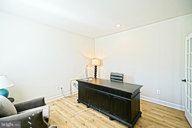 home office with light wood-type flooring, recessed lighting, and baseboards