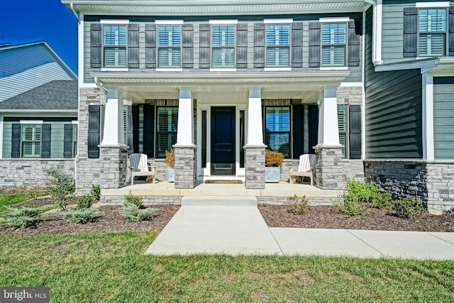 property entrance featuring covered porch