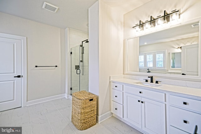 bathroom with a stall shower, visible vents, and marble finish floor