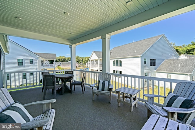 view of patio with a residential view and outdoor dining space