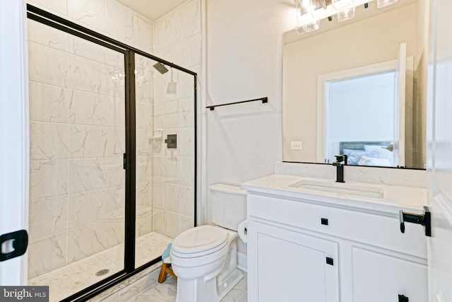 bathroom with a stall shower, toilet, ensuite bathroom, and marble finish floor