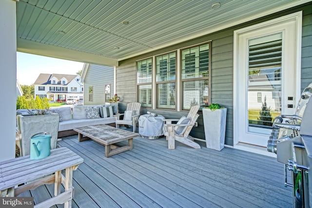 wooden deck featuring an outdoor living space