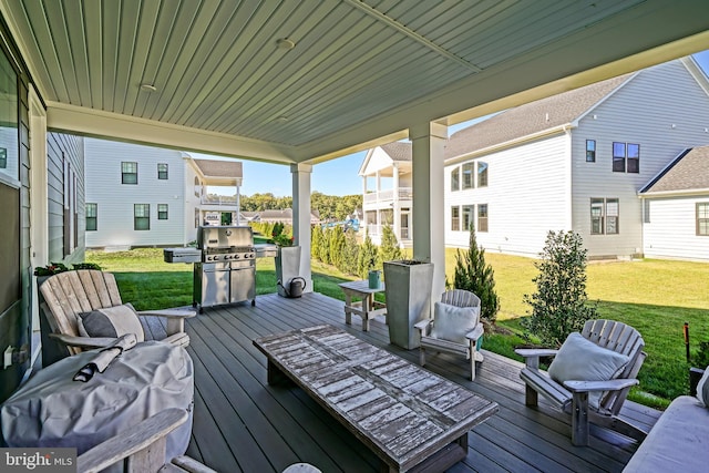 wooden deck with a lawn