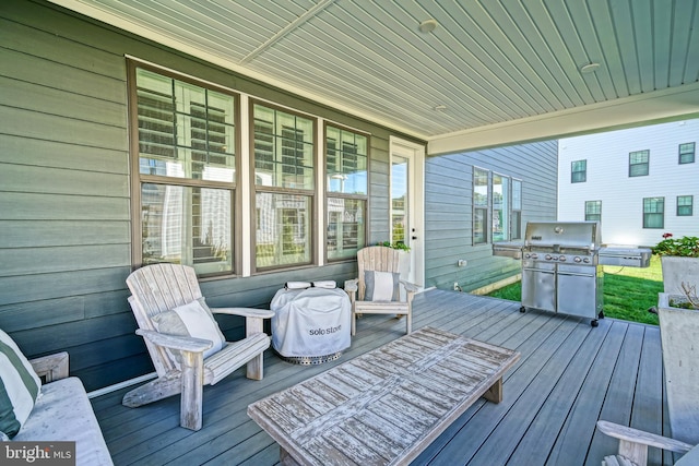 deck featuring a grill