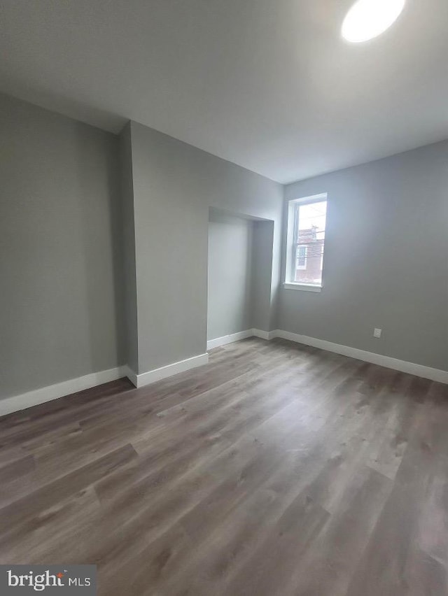 empty room featuring wood-type flooring