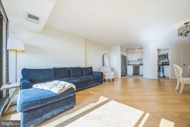 living room with light wood-type flooring