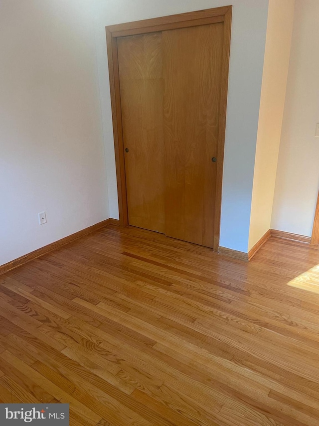 spare room featuring light wood-type flooring