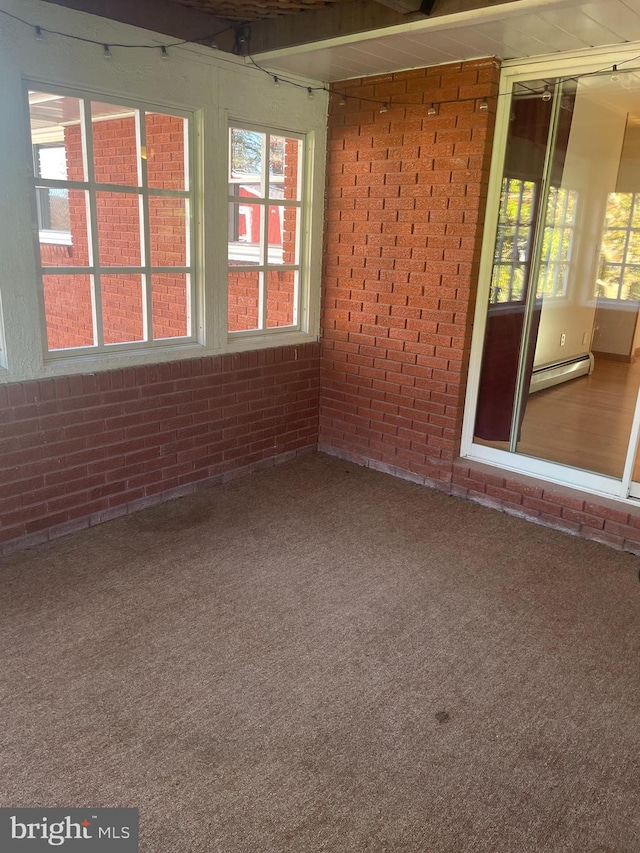 interior space with carpet floors and a baseboard radiator