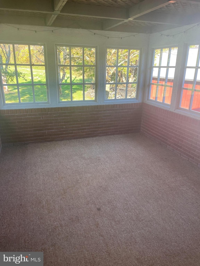 unfurnished sunroom featuring a healthy amount of sunlight