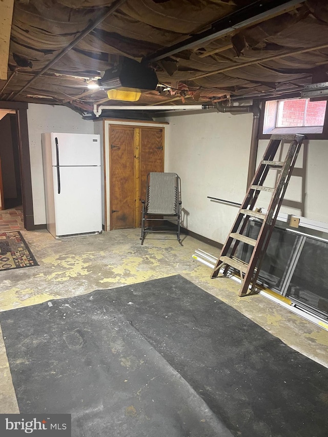 basement with white fridge