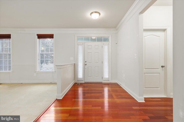 entrance foyer featuring crown molding and dark hardwood / wood-style floors