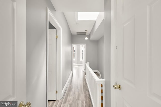 corridor featuring light hardwood / wood-style floors