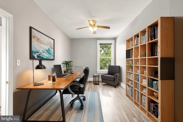 office space featuring light wood-type flooring and ceiling fan