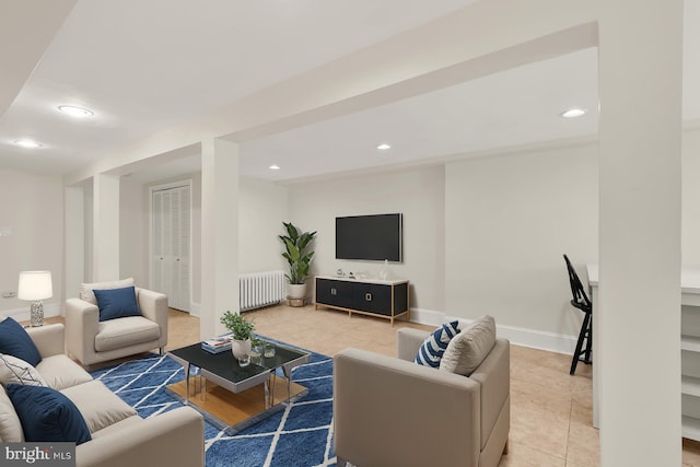 tiled living room featuring radiator