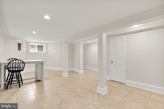 basement featuring light tile patterned floors