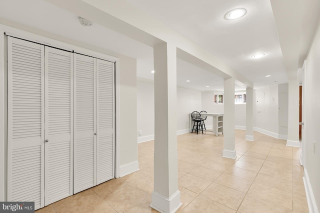 basement with light tile patterned floors