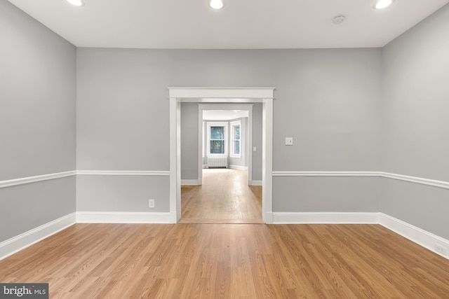 spare room with light hardwood / wood-style floors