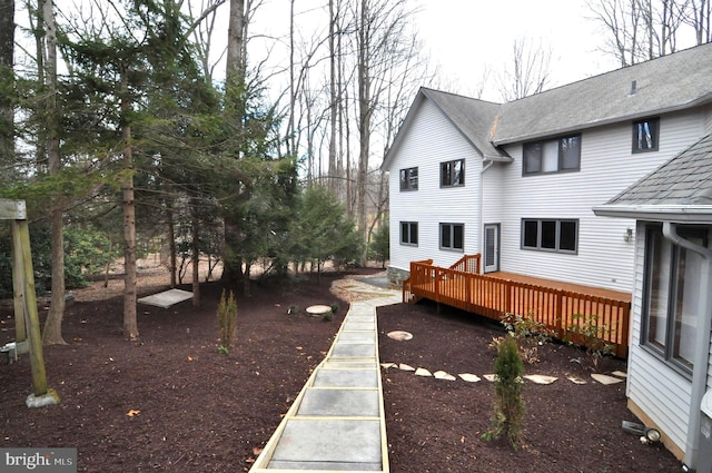 view of yard with a wooden deck